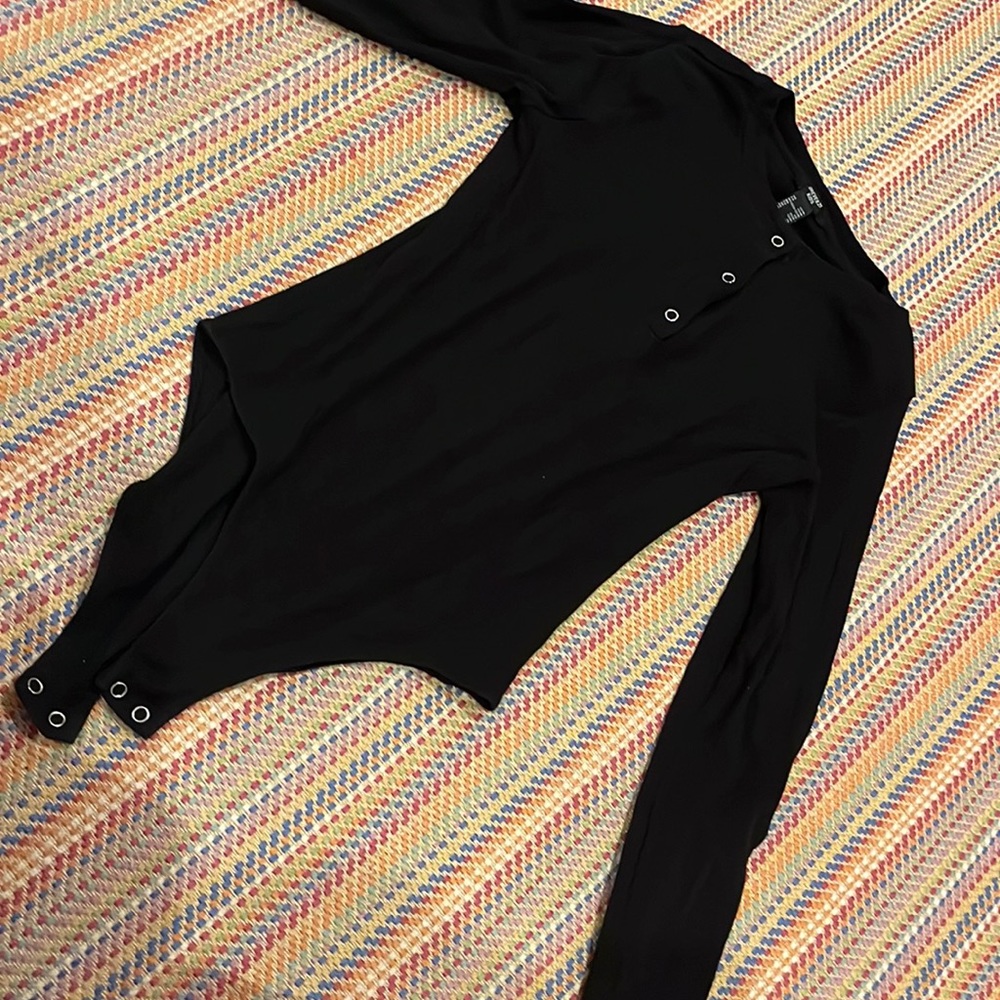 This is a bodysuit from forever, 21 kids and it is a size 13-14